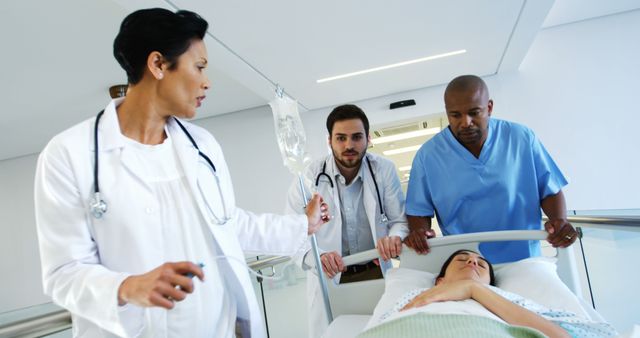 Medical Team Moving Patient on Hospital Stretcher - Download Free Stock Images Pikwizard.com