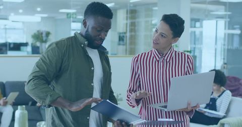 Business Collaboration with Diverse Colleagues in Modern Office