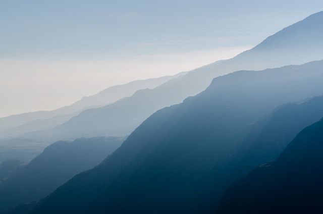 Misty Mountain Layers in Early Morning Light - Download Free Stock Photos Pikwizard.com