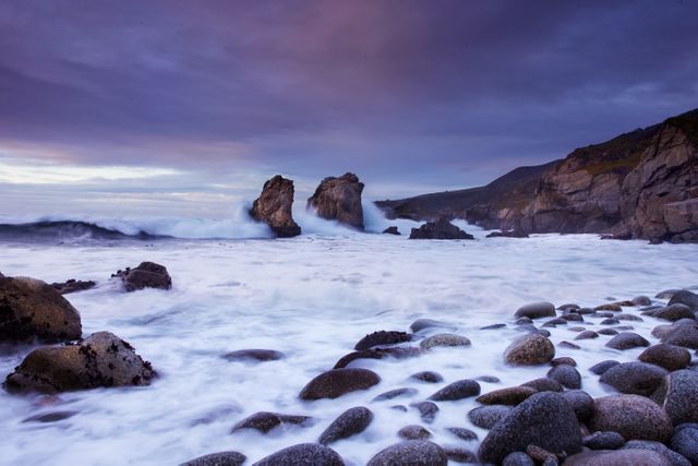 Picturesque coastal landscape featuring rocky shorelines and crashing waves. Ideal for travel magazines, coastal living ads, environmental campaigns, and scenic prints.