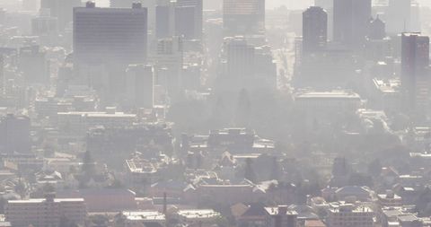 Urban Skyscrapers Shrouded in Thick Fog Reducing Visibility - Download Free Stock Images Pikwizard.com