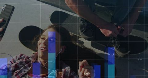 Young friends lying at skatepark listening to music with digital bar chart overlay