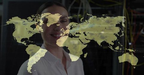 IT Engineer Analyzing World Map Projection in Data Center