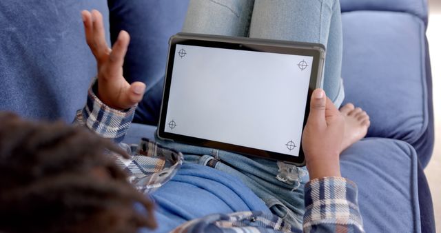 Child Relaxing on Sofa Using Tablet - Download Free Stock Images Pikwizard.com