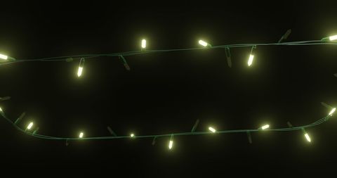 glowing yellow christmas string lights on dark background - Download Free Stock Images Pikwizard.com
