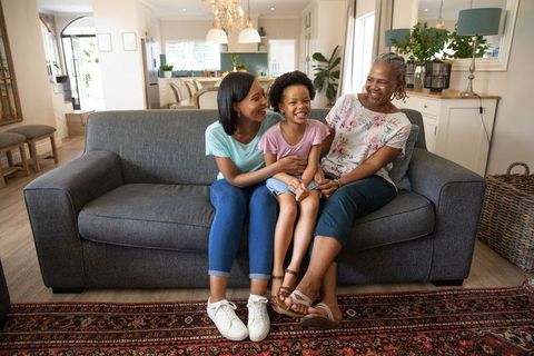 Diverse Multigenerational Family Bonding on Cozy Living Room Sofa