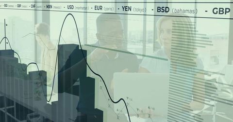 Colleagues Analyzing Financial Reports in Modern Office