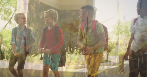Schoolboys Chatting in Sunlit Walk to School - Download Free Stock Images Pikwizard.com