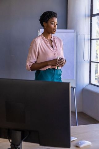 Professional Woman Delivering Compelling Office Presentation