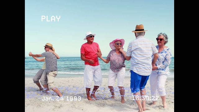 A lively group of diverse seniors having fun while dancing on a sunny beach. Words overlay depicted in vintage video style create nostalgic retro vibes. Ideal for illustrating themes of joyous active holidays, vibrant senior life, and vintage vacation memories.