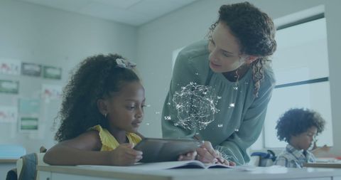 Teacher and Student Engaging with Digital Learning Tablet