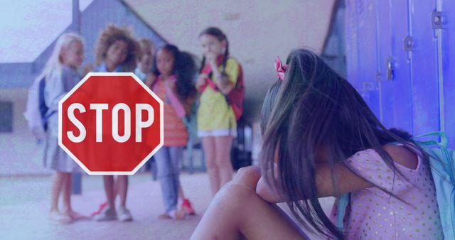 Image of sad schoolgirl crying in school corridor with Stop sign and group of schoolgirls looking at her on distressed flickering background. Education bullying concept digital composite.