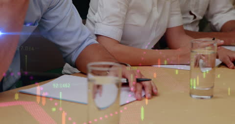 Business Meeting with Stock Data Animation Overlay