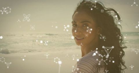 Woman on Beach with Scientific Molecular Visual Effects