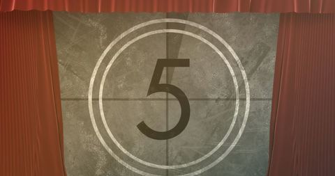 Retro film countdown behind red theater curtains