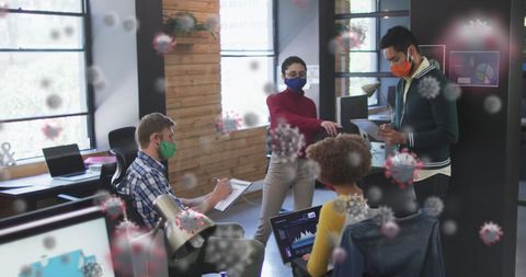 Colleagues Collaborating with Safety Measures in Pandemic