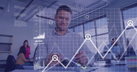 Businessman Analyzing Data with Digital Graphs in Office Environment