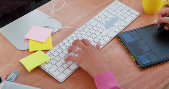 Graphic Designer Working at Desk with Keyboard and Tablet - Download Free Stock Images Pikwizard.com