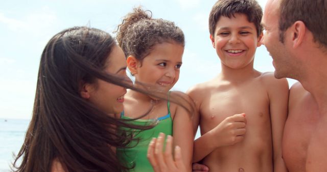 Smiling Family Enjoying Beach Day Together - Download Free Stock Images Pikwizard.com