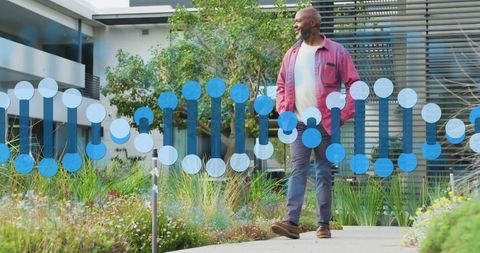 Man strolling courtyard with dna helix overlay, symbolizing wellness