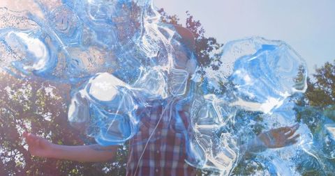 Creating soap bubbles in park on sunny day