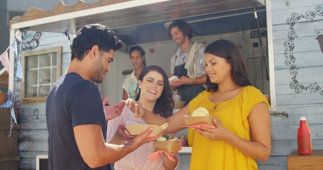 Friends Enjoying Street Food at a Food Truck Festival - Download Free Stock Images Pikwizard.com