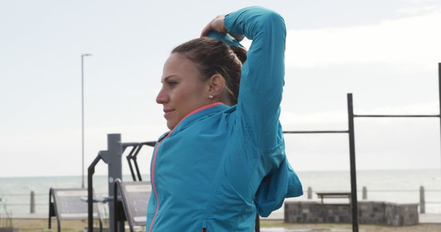 Woman Stretching Outdoors by the Beach - Download Free Stock Images Pikwizard.com