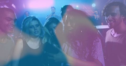 Energetic Friends Group Partying at Nightclub Dance Floor