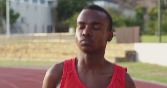 Determined Athlete Running on Outdoor Track - Download Free Stock Images Pikwizard.com