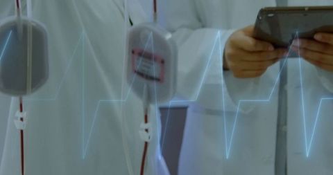 Healthcare professionals using technology in medical environment