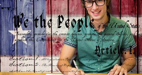 Smiling young man reflects american patriotism with usa flag