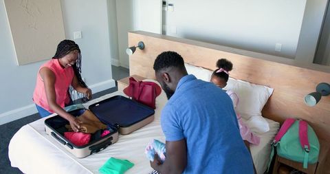 Family Preparing Luggage with Joy for Holiday Adventure