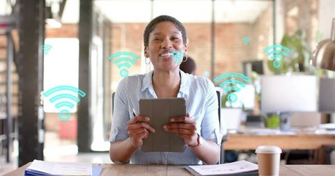 Businesswoman Holding Digital Tablet with Wi-Fi Symbols - Download Free Stock Images Pikwizard.com