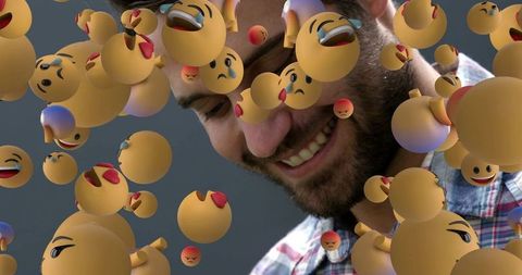 Smiling man surrounded by floating 3d emojis in creative digital scene