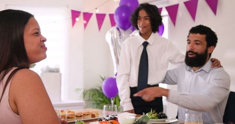 Family celebrating special occasion with joyful meal