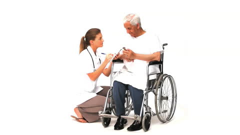 Nurse Conversing with Elderly Patient in Wheelchair
