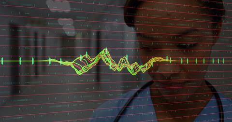 Healthcare professional analyzing vital signs display