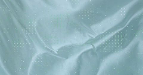 Blue-green silky fabric with abstract dotted pattern