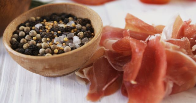 Charcuterie delicious cured prosciutto with peppercorn and seasonings - Download Free Stock Images Pikwizard.com