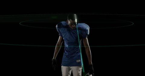 Football Player in Technological Environment with Football Gear