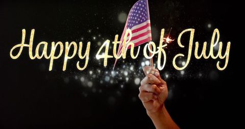 Hand Holding USA Flag with Sparkling 4th of July Text