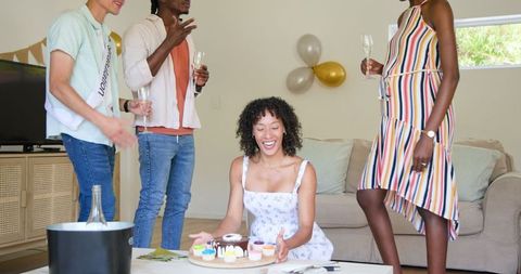 Friends Celebrating Birthday with Sweet Treats and Champagne