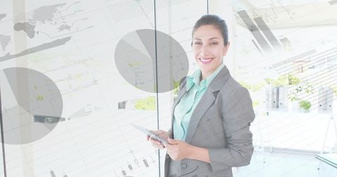 Businesswoman Using Tablet with Digital Finance Graphics Overlay - Download Free Stock Images Pikwizard.com