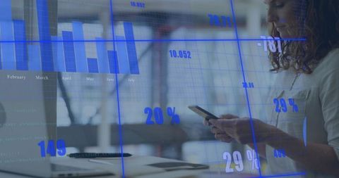Young woman checking smartphone with blue data visualization overlay in modern office