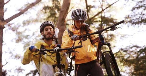 Enthusiastic Cyclists Exploring Forest with Mountain Bikes - Download Free Stock Images Pikwizard.com
