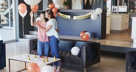 Diverse Senior Friends Celebrating Birthday Party Indoors