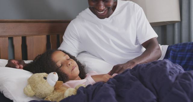 Father Caring for Daughter at Bedtime - Download Free Stock Images Pikwizard.com