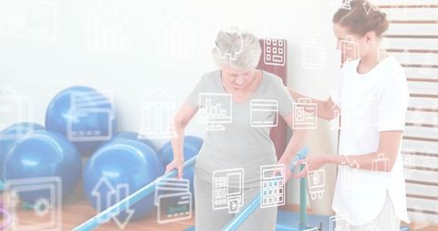 Senior woman regaining mobility with therapist guiding parallel bars in rehab gym post-injury