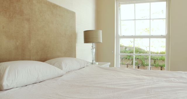 Bright Bedroom with Neutral Decor and Large Window - Download Free Stock Photos Pikwizard.com