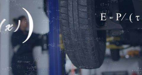 Close-Up of Car Tire on Hydraulic Lift in Auto Workshop